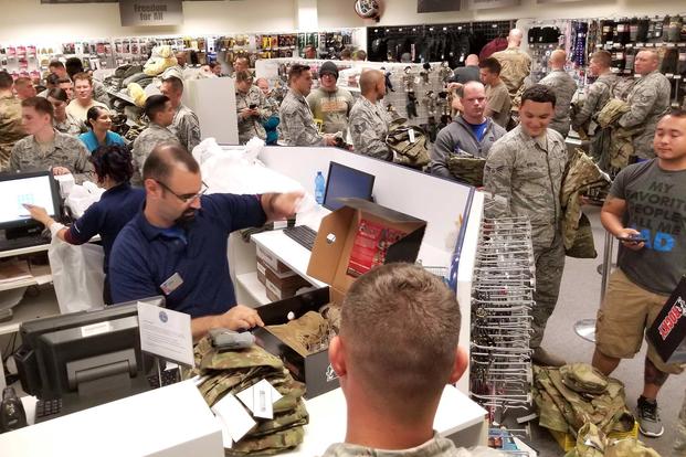 Airmen at Aviano Air Base, Italy, filled the Army and Air Force Exchange Service sales store to purchase the Operational Camouflage Pattern utility uniform on Oct. 1, 2018. Mikia Muhammad/Defense Logistics Agency