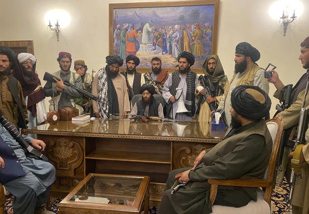 Taliban fighters take control of the Afghan presidential palace in Kabul, Afghanistan, after President Ashraf Ghani fled the country