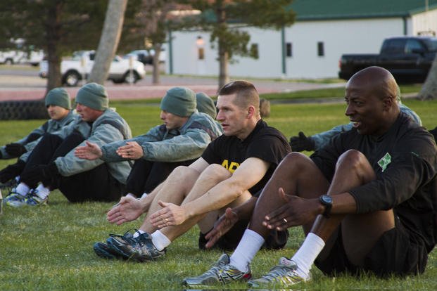Drill sergeant and recruiter candidates do warm-up exercises on Fort Carson, Colo.