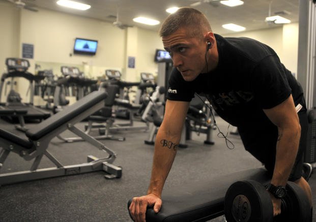 A senior airman performs one-arm dumbbell rows in the Predator Fitness Center at Creech Air Force Base, Nevada.