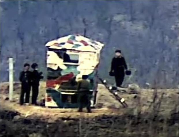 North Korean soldiers install their guard post in the Demilitarized Zone