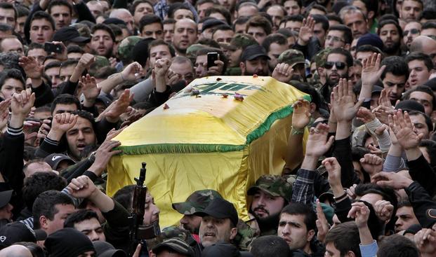 Hezbollah fighters carry the coffin of Jihad Mughniyeh.
