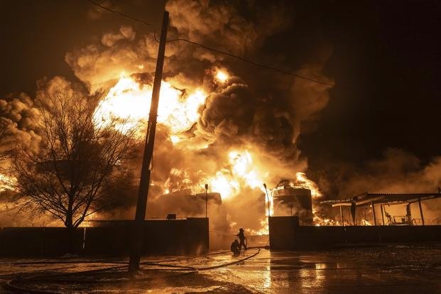 Firefighters extinguish a fire after a Russian attack on a neighborhood in Kharkiv, Ukraine.