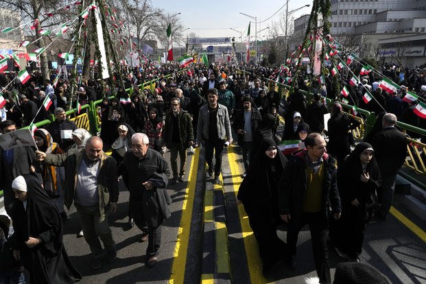Iranians attend the annual rally commemorating the 1979 Islamic Revolution. 
