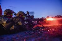 Marine Special Operations School Individual Training Course students fire an M249 squad automatic weapon during night-fire training April 13, 2017, at Camp Lejeune. (U.S. Air Force/Senior Airman Ryan Conroy)