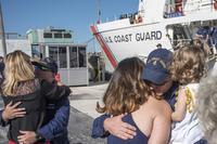 Crewmembers aboard the Coast Guard Cutter Resolute are greeted Monday, Dec. 31, 2018 at their homeport in St. Petersburg, Florida following a 59-day patrol in the Caribbean. (U.S. Coast Guard/Petty Officer 1st Class Michael De Nyse)