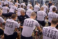 Recruits are instructed on the proper way to ride a stationary bike.