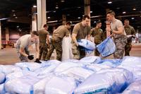Members of the Illinois Air National Guard assemble medical equipment.