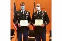 Capt. Stephen Scott and Chief Warrant Officer 4 Eric Carver receive the Distinguished Flying Cross.
