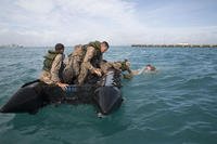Marine Expeditionary Force practices stabilizing watercraft in Japan