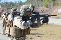 Marine shoots M4 carbine rifle.