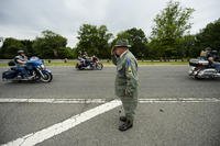 A supporter salutes motorcyclists in Rolling Thunder 2017.