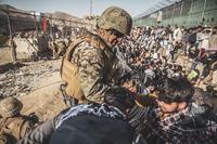U.S. Marin assists evacuation at Hamid Karzai International Airport, Kabul.