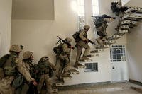 US Marines of the 1st division enter a house in Fallujah, Iraq, in 2004.