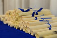 Community College of the Air Force diplomas lay on a table at Spangdahlem Air Base, Germany.