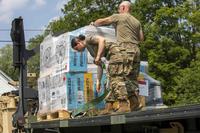 Vermont Army National Guard soldiers unload items for donation