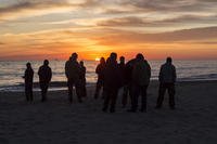 Sailors in the Fleet Transition Program (FTP) gather at sunrise to participate in a weekly beach run in Virginia Beach, Virginia.