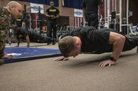 Officer candidate Glenn Halm of the Macon, Georgia-based Officer Readiness Program grinds to complete the push-up portion of the Army Physical Fitness Test.