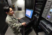 Airman First Class Sabrina Zarate, 88th Communication Squadron server operations system administrator, conducts a real-time test on a computer server on Wright-Patterson Air Force Base, Ohio.
