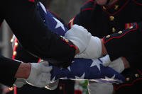 Folding the flag at a Marine funeral.