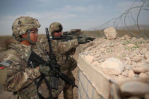 U.S. Army 1st Lt. Audrey Griffith, left, and Spc. Heidi Gerke, both with the 92nd Engineer Battalion, stand guard during a force protection exercise at Forward Operating Base Hadrian in Uruzgan province, Afghanistan, March 18, 2013. DoD courtesy photo
